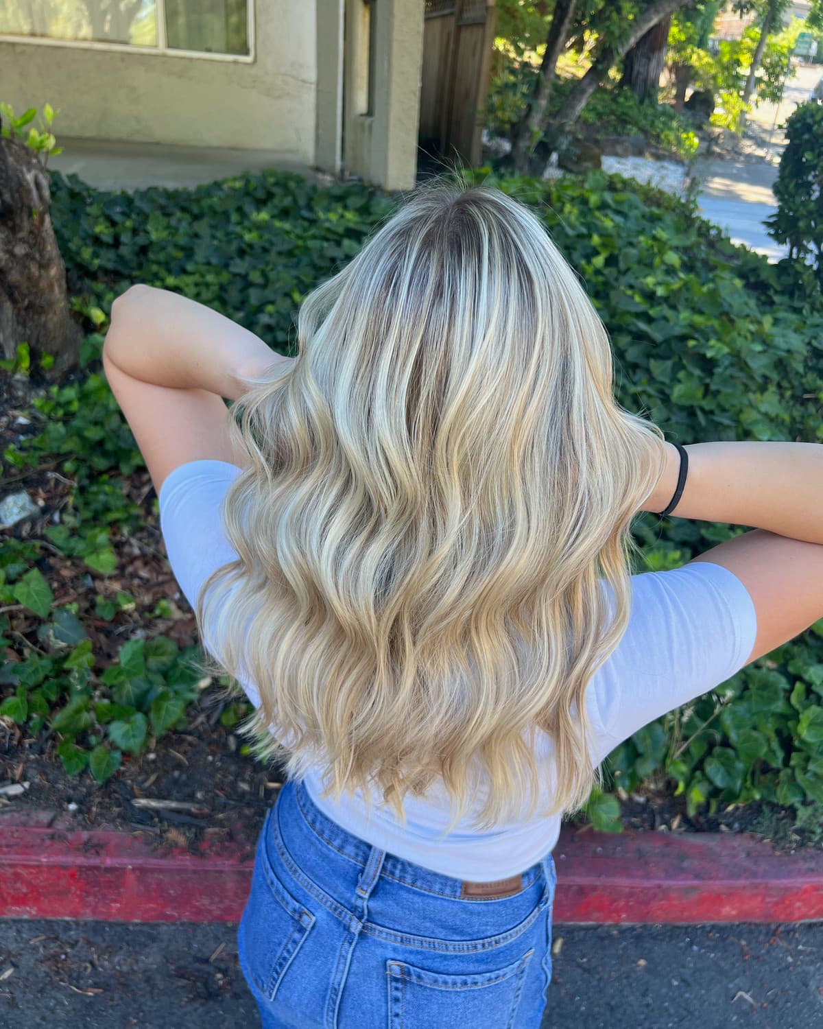 Long blended blonde waves colored by Courtney Morgan